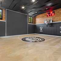 <p>A basketball half court at&nbsp;70 Cobb Lane in Water Mill.</p>