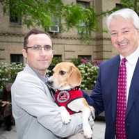 <p>New York state Sen. Phil Boyle (R-Suffolk County) stands with a member of The Beagle Freedom Project and a rescued dog. Boyle sponsored a bill that would required state-funded research facilities to have adoption programs for retired lab animals.</p>