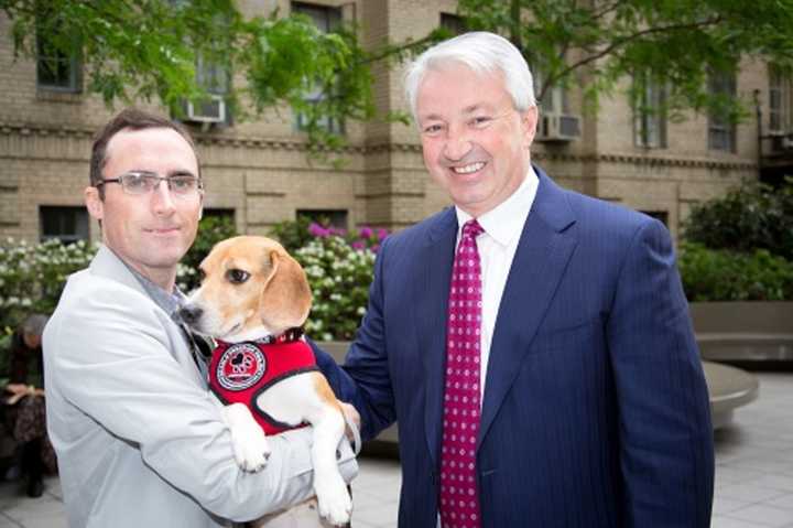 New York state Sen. Phil Boyle (R-Suffolk County) stands with a member of The Beagle Freedom Project and a rescued dog. Boyle sponsored a bill that would required state-funded research facilities to have adoption programs for retired lab animals.