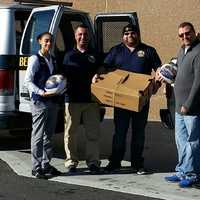 <p>Members of Bergen County Sheriff Michael Saudino&#x27;s Community Outreach Unit with Wal-Mart manager in Teterboro.</p>