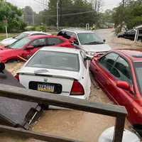 <p>Hugo and MarciLena Ortega&#x27;s cars destroyed in the flood.</p>