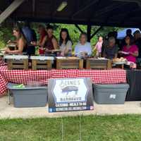 <p>Event goers enjoy a spread from Bernie&#x27;s Blue Line Barbecue.</p>