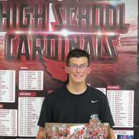 <p>Westwood High School freshman Billy Cook signed his 7,000th baseball with his team.</p>