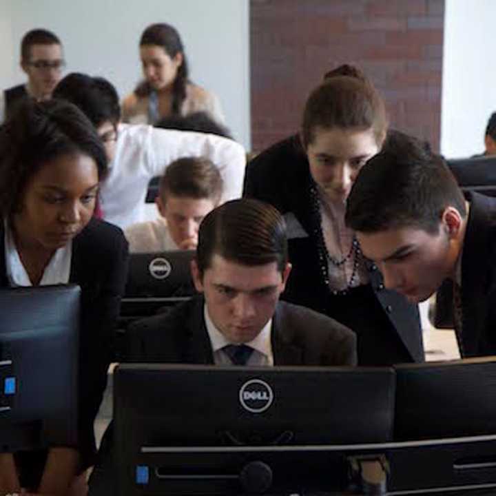 Second place winners from Fairfield Ludlowe, Sydney Sims, Brian Damp, Cordelia Murphy and Sean Gutierrez, work hard on their challenge.