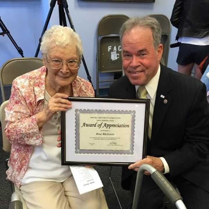 Rose Blickstein, a veteran of World War II who participated in the D-Day invasion, is given a certificate of appreciation by Rockland County Executive Ed Day Monday. Blickstein, 95, is a resident of Nanuet.