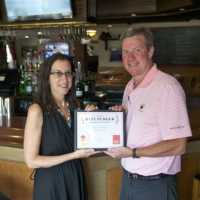 <p>Features Editor Jeanne Muchnick awards Bogey&#x27;s Owner Jim Stablein with the DVlicious award. </p>