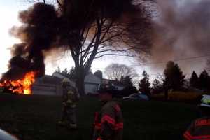 Car Fire Causes Wood Pile To Ignite In Brookfield