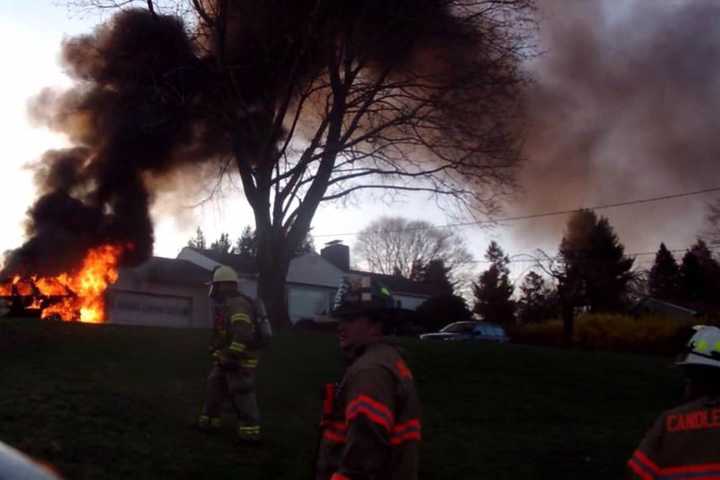Car Fire Causes Wood Pile To Ignite In Brookfield