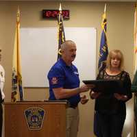 <p>Morse presents plaque to Petuzzello&#x27;s parents.</p>