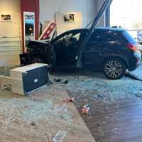 'Like An Earthquake': Video Shows Car Slamming Into Burlington Eye Care Store