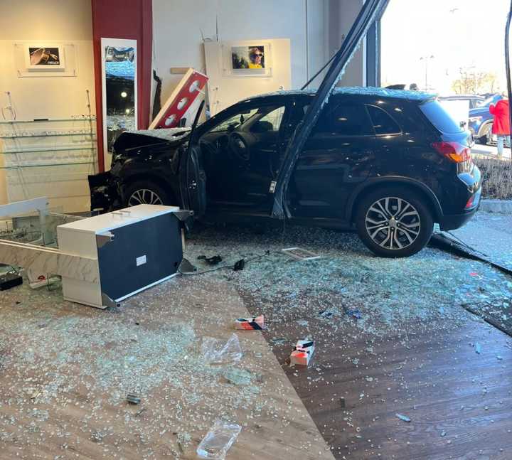 A 2019 Mitsubishi Outlander crashed into an eye care store on Middlesex Turnpike on Tuesday, Dec. 12.