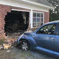 <p>The 2006 Chrysler RT Cruiser being pulled out of the living room of a home in the 1000 block of Columbia Avenue Lancaster, Pennsylvania.</p>