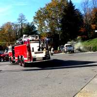 <p>Smoke from the engine compartment can be seen from across the parking lot</p>