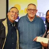 <p>Tom Chiappetta, left, Executive Director of the Fairfield County Sports Commission donates to the Carver Center in Norwalk, with (left to right) Dick Whitcomb, Novelette Peterkin and Joe Gallagher.</p>