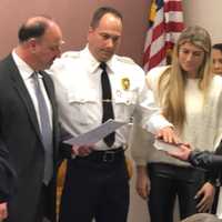 <p>New South Hackensack Deputy Police Chief Robert Kaiser being sworn in, joined by his family.</p>