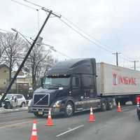 <p>The pole hung precariously over the northbound lanes of Route 1/9, forcing Ridgefield police to divide the southbound lanes to divert traffic.</p>