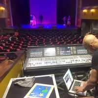 <p>Wall Street Theater Artistic Director Billy Blanks, Jr. checks the sound while the Teen Theater Program rehearses.</p>