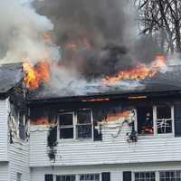 <p>Flames quickly spread, then blew through the roof of the home on Cheryll Lane in Old Tappan on April 7.</p>