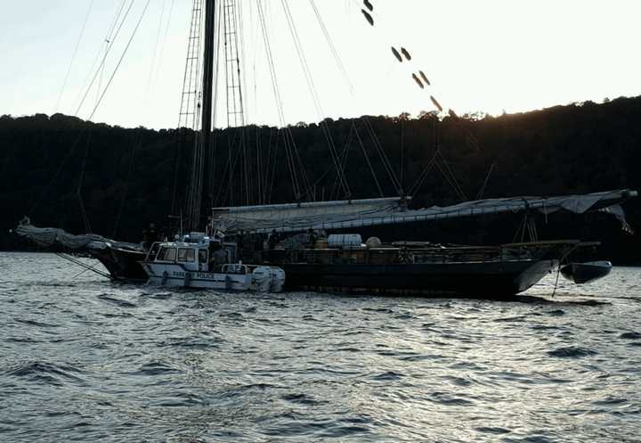 Marine units fetching passengers from the sloop Clearwater.