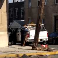 <p>The pole tipped precariously over the intersection.</p>