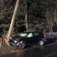 <p>A car slammed into a utility pole on Daniels Farm Road near Hedgehog Road early Saturday.</p>