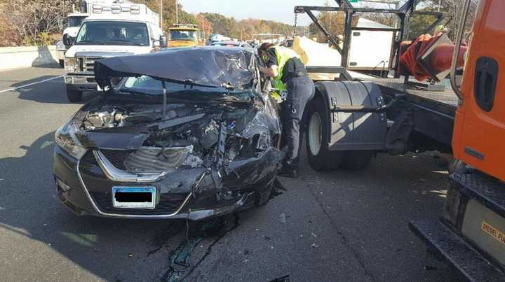 A Nissan Maxima traveling in the left lane of I-95 struck the rear of a DOT &#x27;crash truck&#x27; in a construction zone in Milford on late Wednesday morning.