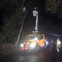 <p>United Illuminating crews go to work to repair the pole.</p>