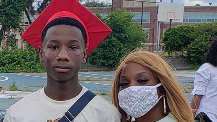 Curtis Ashford Jr. stands with his mom Starsha Groce after his eighth-grade graduation. Curtis, who turned 15 over the summer, was shot and killed outside of Dorchester Park on July 28.