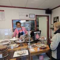 <p>Angela cheerfully serves a customer on a gray and raining day. She makes you feel like she's glad you're there.</p>