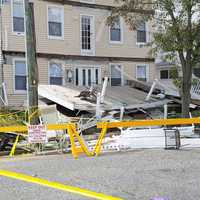 <p>The victims were gathered at a three-story home on East Baker Avenue Saturday night when the upper deck gave way, pancaking those below, responders said.</p>