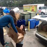 <p>Food &quot;rescuers&quot; volunteers Abby Straight and Emma Straight load a car to make a delivery for Food Rescue US.</p>