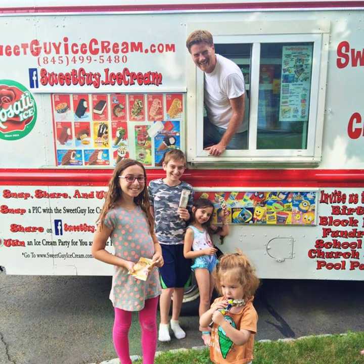 John Monahan with his SweetGuy Ice Cream Truck and some very happy patrons.