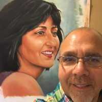 <p>David Budway sits in front of a painting of his sister, Maureen.</p>