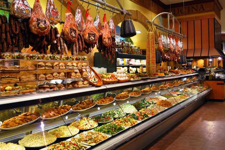 Prepared foods in a display case at the deli inside Uncle Giuseppe&#x27;s Marketplace