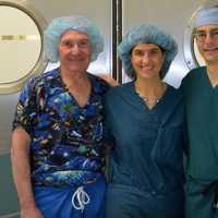 <p>From left, Dr. Lee Eisenberg, Dr. Robin Brody, and Dr. Dan Grinberg volunteer at a facility. </p>