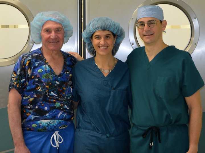 From left, Dr. Lee Eisenberg, Dr. Robin Brody, and Dr. Dan Grinberg volunteer at a facility. 