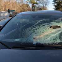 <p>Weston police are investigating after a suspension spring smashed into a driver's windshield on Route 20.</p>