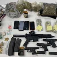 <p>Some of the seized drugs and weapons in Prince George's County.</p>