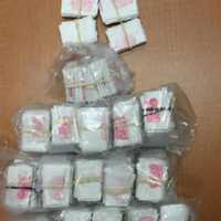 <p>1,000 bags of heroin, 45 grams of loose heroin, 15 grams of cocaine, two handguns and and $9,000 in cash were seized in the drug trafficking bust, state police said.</p>