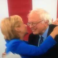 <p>Hillary Clinton embraces Bernie Sanders at a rally Tuesday.</p>