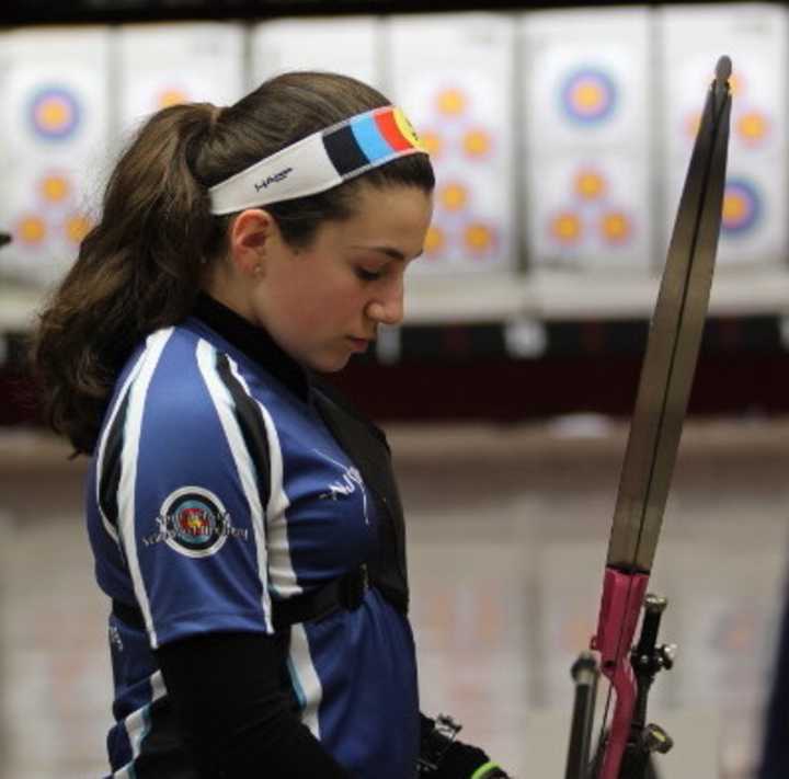 Emilie Simoni prepares to shoot her bow.