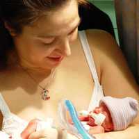 <p>Marisela Esposito holds her son, Dante, for the first time after he was born prematurely at 25.3 weeks in 2003. The boy weighed 1 pound, 15 ounces and spent his first three months in a neonatal intensive care unit.</p>