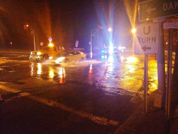 Water bubbled up across Plaza Road.