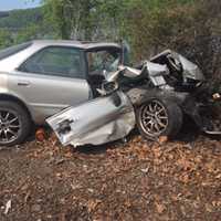 <p>All that remains of a car hit by a train in Hyde Park Friday is a twisted heap of metal. Two people inside were able to escape safely before the train hit. Police are investigating the cause of the incident. No one one the train was hurt.</p>