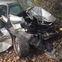 <p>The front of this car was demolished when it was struck Friday by an Amtrak train in Hyde Park. The two people inside had escaped safely and no one on the train was injured.</p>