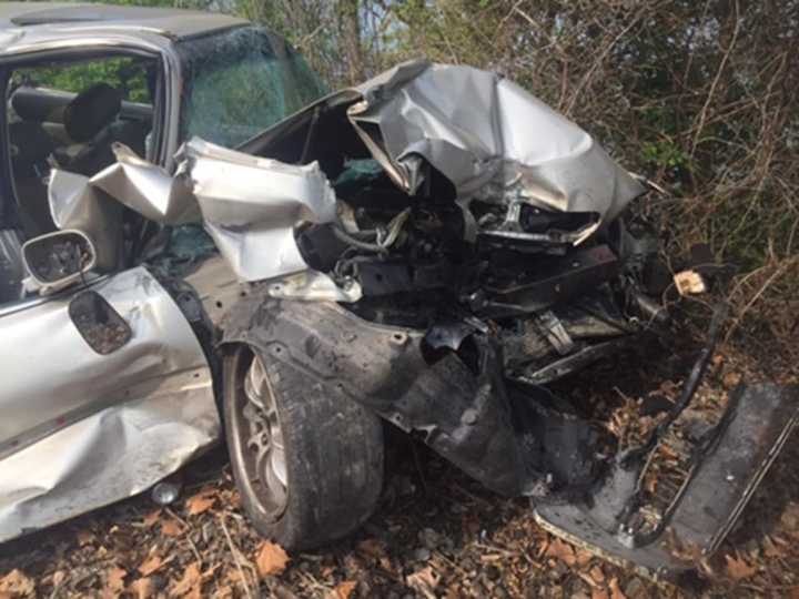 The front of this car was demolished when it was struck Friday by an Amtrak train in Hyde Park. The two people inside had escaped safely and no one on the train was injured.