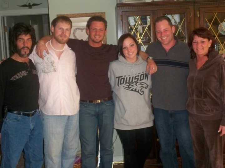 Nick Arnoldi, center, with his family three years before he killed himself.