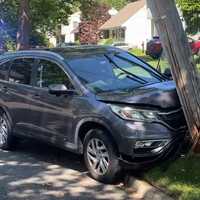 SUV Driver Hospitalized After Shattering Utility Pole In Ridgewood
