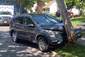 SUV Driver Hospitalized After Shattering Utility Pole In Ridgewood