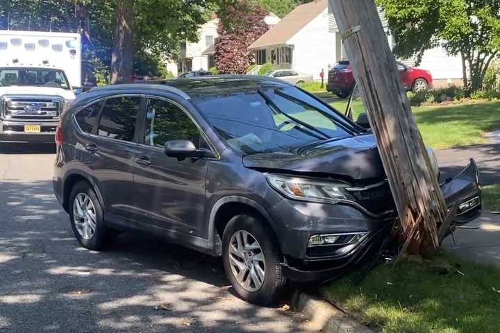 SUV Driver Hospitalized After Shattering Utility Pole In Ridgewood